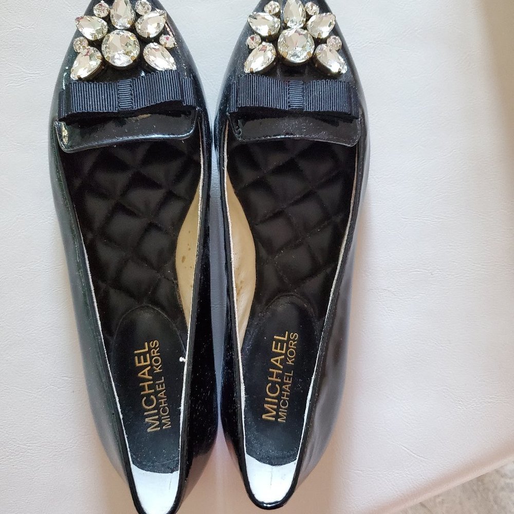 The MICHAEL Michael Kors embellished black flats, adorned with  crystals.